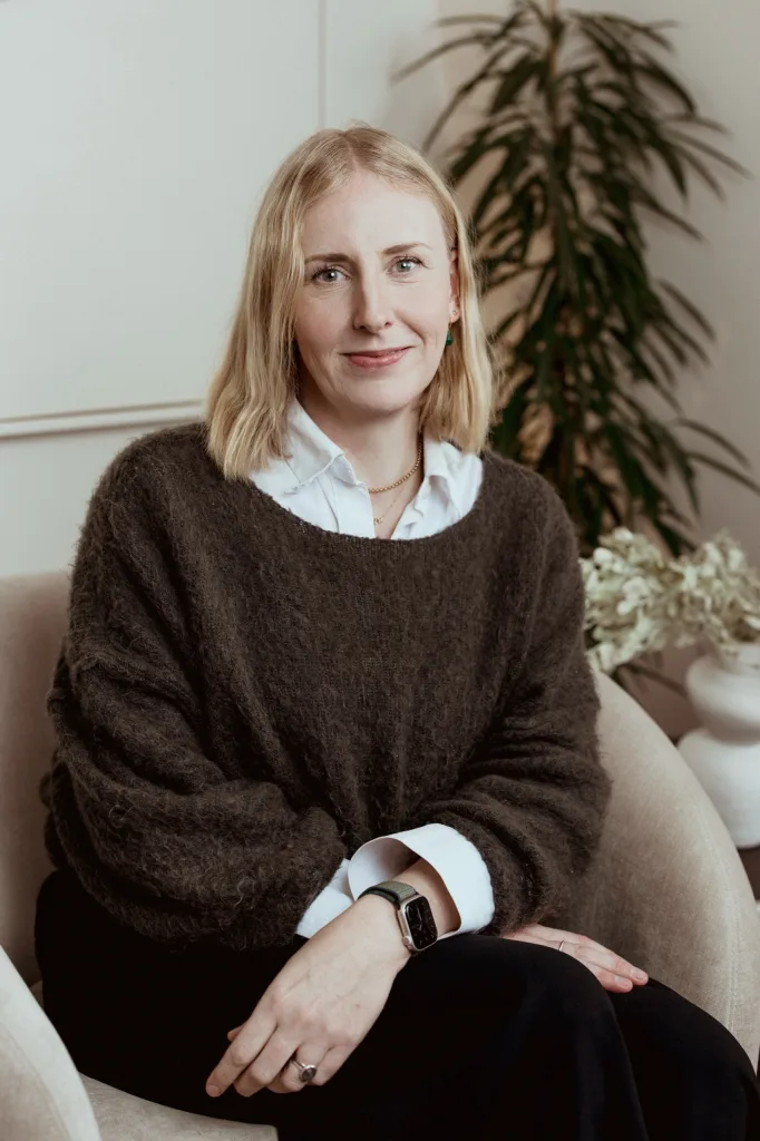 Portrait of Andrea Dobson, Counselling Psychologist at London Bridge Therapy, seated in a clinic consulting room