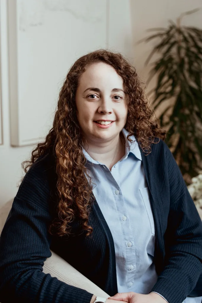 Portrait of Dr Liza Turner, Clinical Psychologist at London Bridge Therapy, seated in a clinic consulting room