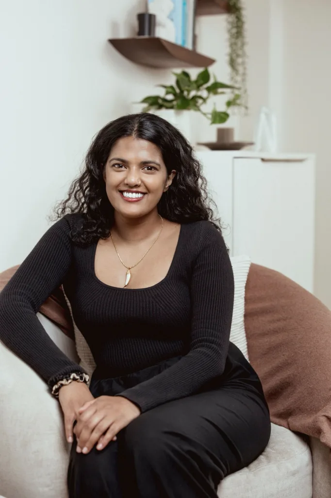 Portrait of Dr Sujeena Navajeeva, Clinical Psychologist at London Bridge Therapy, seated in a consulting room