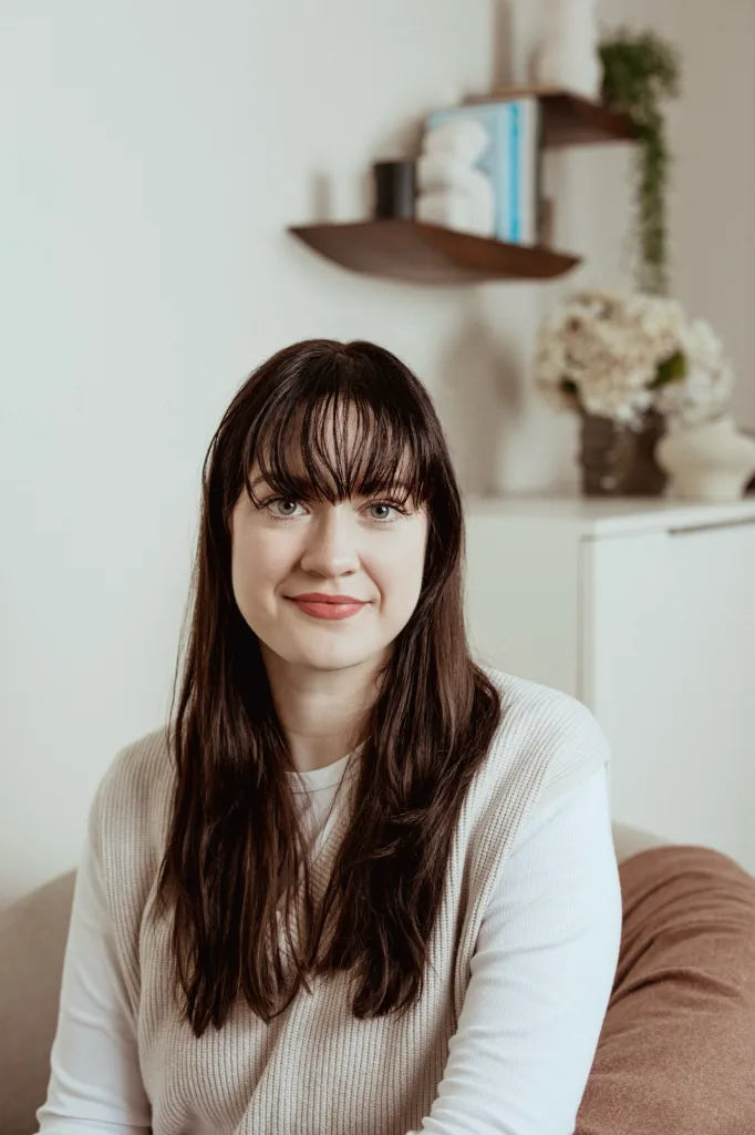 Portrait of Dr Zoe Delaney, Clinical Psychologist at London Bridge Therapy, seated in a clinic consulting room